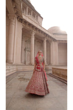 Load image into Gallery viewer, BLOOD RED RAW SILK LEHENGA CHOLI AND BELT WITH TULLE DUPATTA WITH AN OPTIONAL LIGHTER SECOND DUPATTA