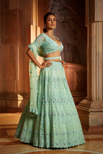 Load image into Gallery viewer, VIBRANT MINT GREEN TULLE LEHENGA CHOLI DUPATAA WITH A WORKED BELT
