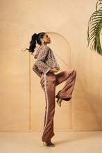 Load image into Gallery viewer, Intricate embelishment of pearls, cutdana, beads, and crystal stones on blouse , hoodie, and side of the pant.