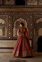 Load image into Gallery viewer, RED RAW SILK LEHENGA CHOLI WITH A NET DUPATTA AND AN OPTIONAL SECOND TISSUE DUPATTA WHICH CAN BE ORDERED SEPARATELY