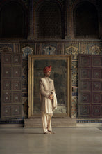 Load image into Gallery viewer, MOCCA RAW SILK SHERWANI WITH KURTA AND CHURIDAR. IT COMES WITH AN OPTIONAL WORKED STOLE, BELT AND JUTTIS