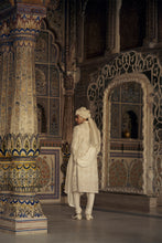 Load image into Gallery viewer, IVORY AND BEIGE RAW SILK SHERWANI SET WITH KURTA AND CHURIDAR AND AN OPTIONAL BELT, STOLE AND JUTIS