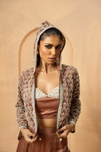 Load image into Gallery viewer, Intricate embelishment of pearls, cutdana, beads, and crystal stones on blouse , hoodie, and side of the pant.