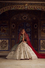 Load image into Gallery viewer, SILVER TISSUE LEHENGA CHOLI SET WITH AQUA NET DUPATTA AND AN OPTIONAL RED NET DUPATTA AND A HEAD VEIL WHICH CAN BE ORDERED SEPARATELY