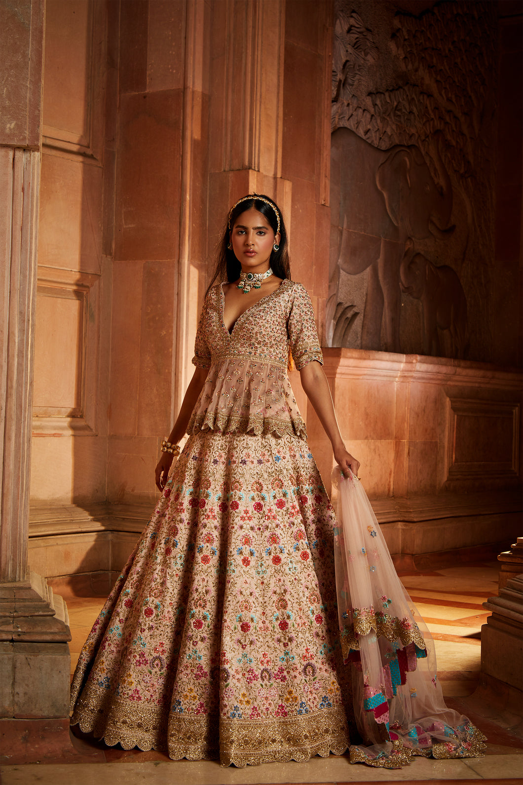 BLUSH PINK RAW SILK LEHENG WITH A PEPLUM TOP AND TULLE DUPATTA