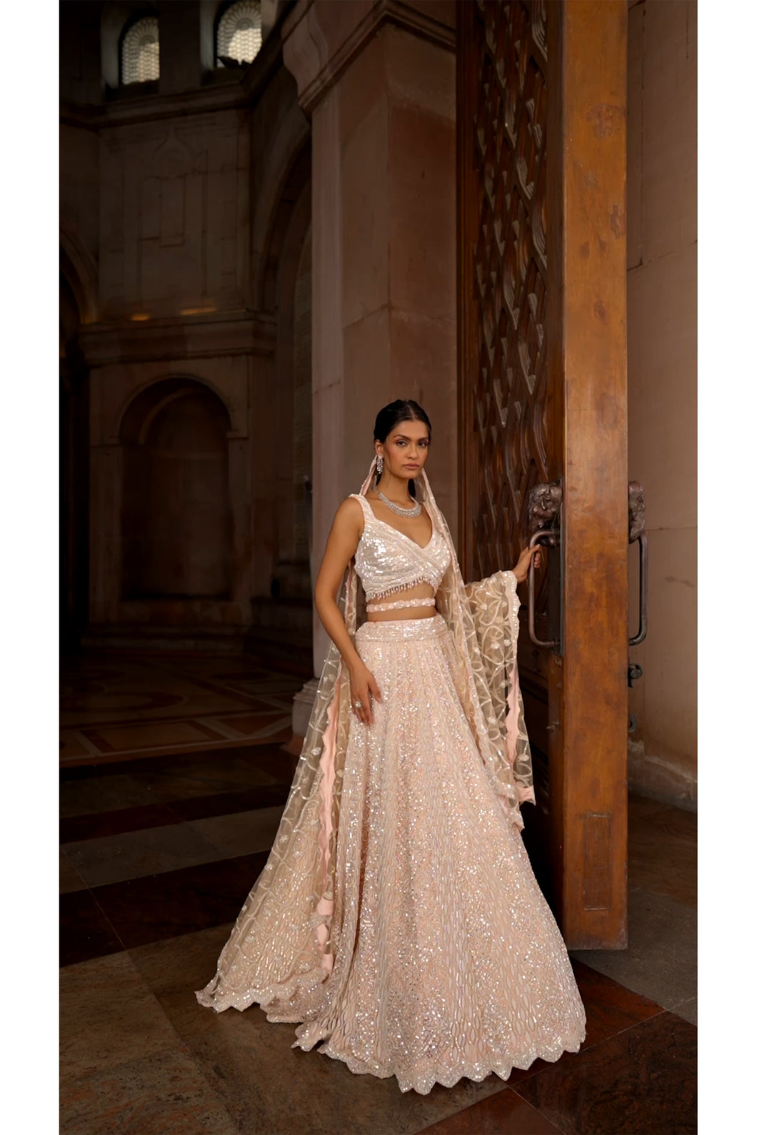 NUDE PINK TULLE LEHENGA CHOLI DUPATTA SET WITH WORKED BELT