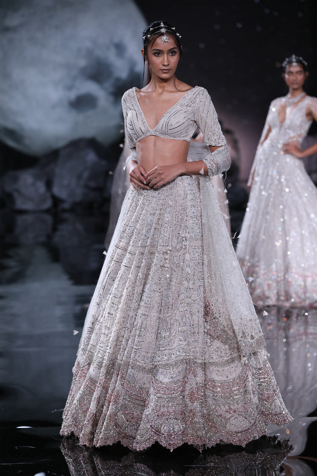 Paired with pearl and mukaish choli and  Embroidered shimmer Tulle dupatta