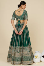 Load image into Gallery viewer, Bottle green raw silk embroidered lehenga
