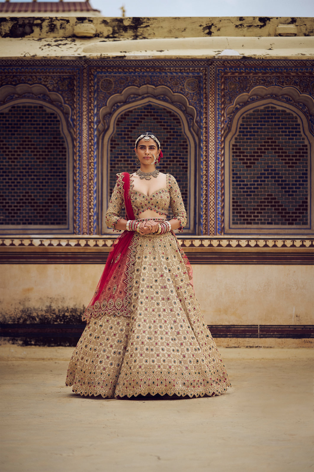 GOLD TISSUE LEHENGA CHOLI SET WITH RED DUPATTA AND AN OPTIONAL MINT GREEN DUPATTA, BELT AND GOLD HEAD VEIL .