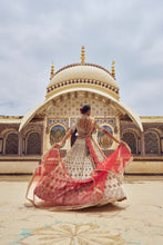 Load image into Gallery viewer, GOLD TISSUE LEHENGA CHOLI WITH A PEACH  TISSUE  DUPATTA AND AN OPTIONAL RED DUPTTA AND BELT WHICH CAN BE ORDERED SEPATATELY.
