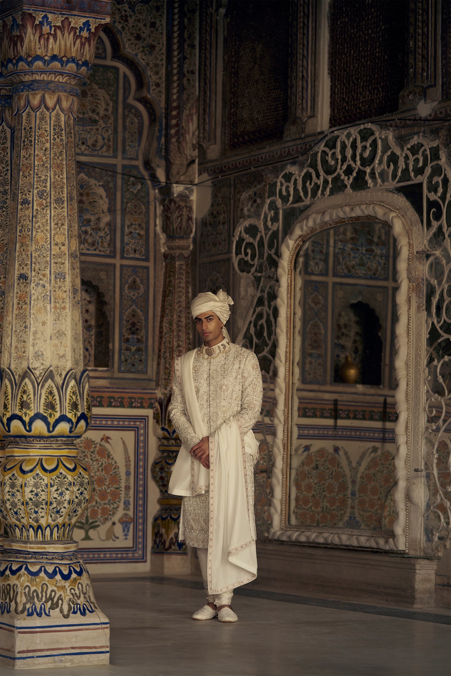 IVORY AND BEIGE RAW SILK SHERWANI SET WITH KURTA AND CHURIDAR AND AN OPTIONAL BELT, STOLE AND JUTIS