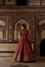 Load image into Gallery viewer, RED RAW SILK LEHENGA CHOLI WITH A NET DUPATTA AND AN OPTIONAL SECOND TISSUE  DUPATTA  WHICH CAN BE ORDERED SEPARATELY
