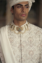 Load image into Gallery viewer, IVORY AND BEIGE RAW SILK SHERWANI SET WITH KURTA AND CHURIDAR AND AN OPTIONAL BELT, STOLE AND JUTIS
