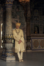 Load image into Gallery viewer, GOLD RAW SILK SHERWANI WITH KURTA AND CHURIDAR WITH AN OPTIONAL WORKED BELT, STOLE AND JUTIS.
