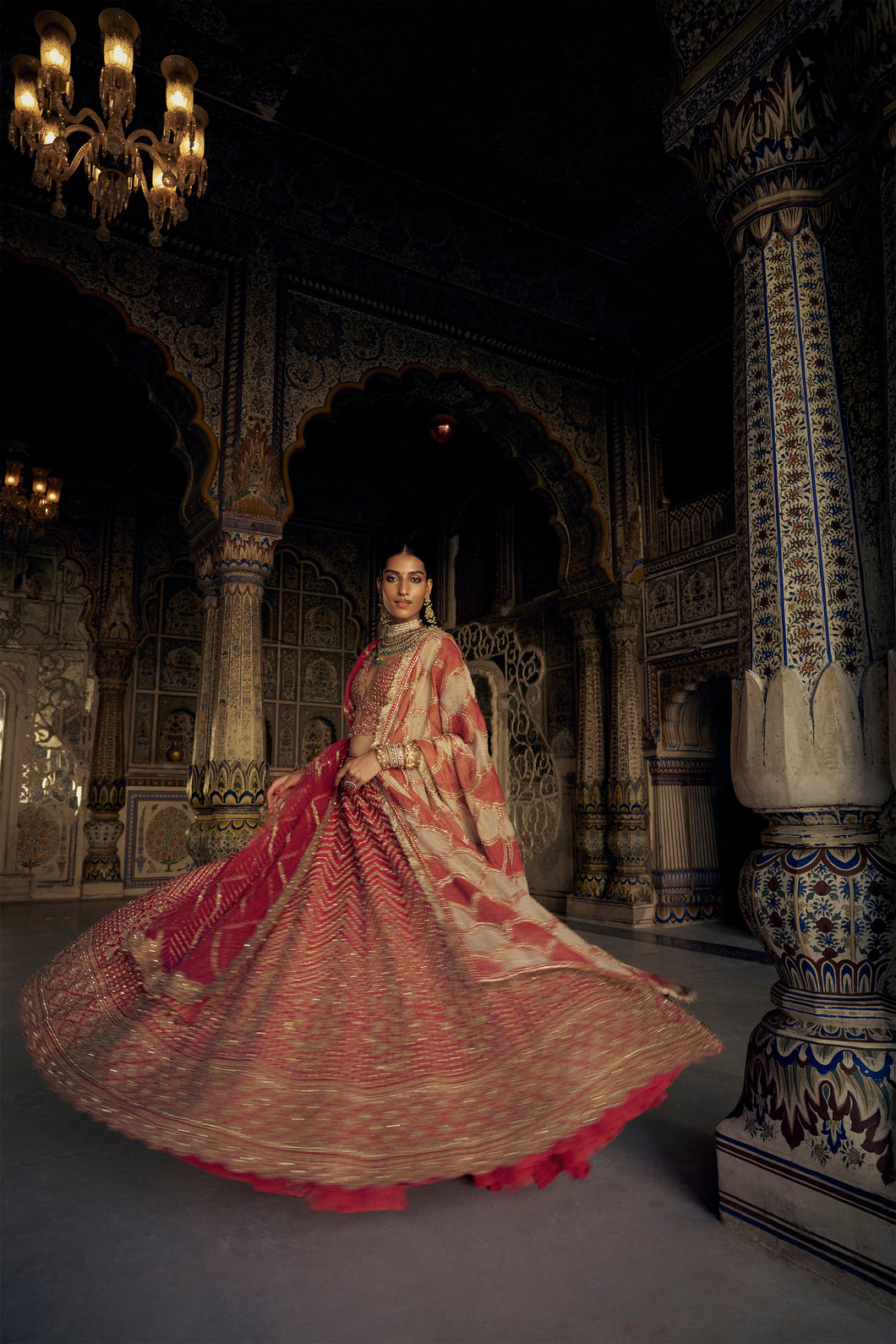 RED RAW SILK LEHENGA CHOLI WITH A NET DUPATTA AND AN OPTIONAL SECOND DUPATTA AND BELT WHICH CAN BE ORDERED SEPARATELY