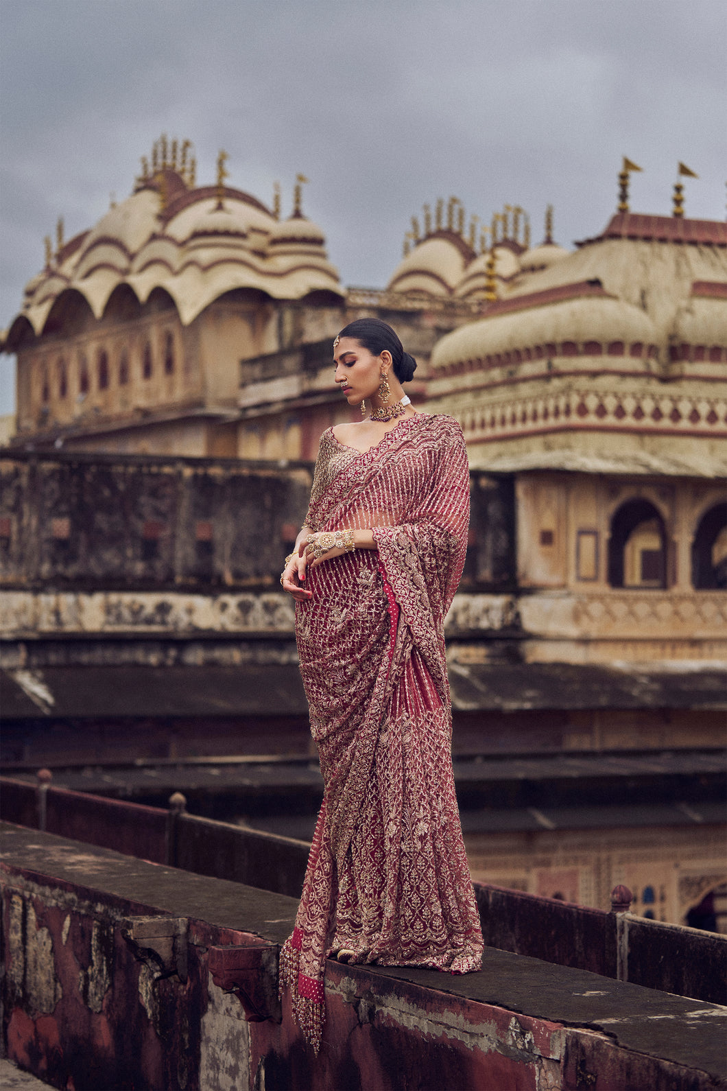 MAROON NET EMBROIDERED SAREE BLOUSE WITH PETTICOAT AND AN OPTIONAL HEAD VEIL .