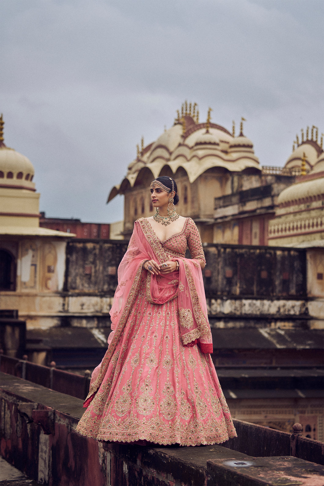 ROSE PINK RAW SILK LEHENGA CHOLI WITH NET DUPATTA AND OPTIONAL WORKED BELT .