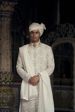 Load image into Gallery viewer, IVORY AND BEIGE RAW SILK SHERWANI SET WITH KURTA AND CHURIDAR AND AN OPTIONAL BELT, STOLE AND JUTIS
