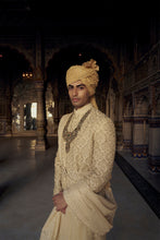 Load image into Gallery viewer, GOLD RAW SILK SHERWANI WITH KURTA AND CHURIDAR WITH AN OPTIONAL WORKED BELT, STOLE AND JUTIS.
