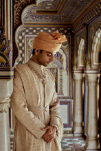 Load image into Gallery viewer, MUSHROOM RAW SILK SHERWANI WITH A COTTON SILK KURTA AND CHURIDAR AND OPTIONAL STOLE BELT AND WORKED JUTIS.
