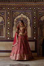 Load image into Gallery viewer, RED RAW SILK LEHENGA CHOLI WITH A NET DUPATTA AND AN OPTIONAL SECOND TISSUE  DUPATTA  WHICH CAN BE ORDERED SEPARATELY
