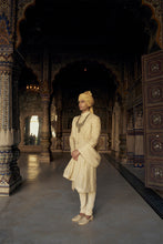 Load image into Gallery viewer, GOLD RAW SILK SHERWANI WITH KURTA AND CHURIDAR WITH AN OPTIONAL WORKED BELT, STOLE AND JUTIS.
