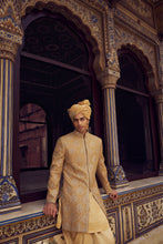 Load image into Gallery viewer, GOLD RAW SILK SHORT SHERWANI WITH A SATIN KURTA AND DHOTI WITH AN OPTIONAL WORKED STOLE AND JUTIS
