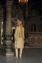 Load image into Gallery viewer, GOLD RAW SILK SHERWANI WITH KURTA AND CHURIDAR WITH AN OPTIONAL WORKED BELT, STOLE AND JUTIS.
