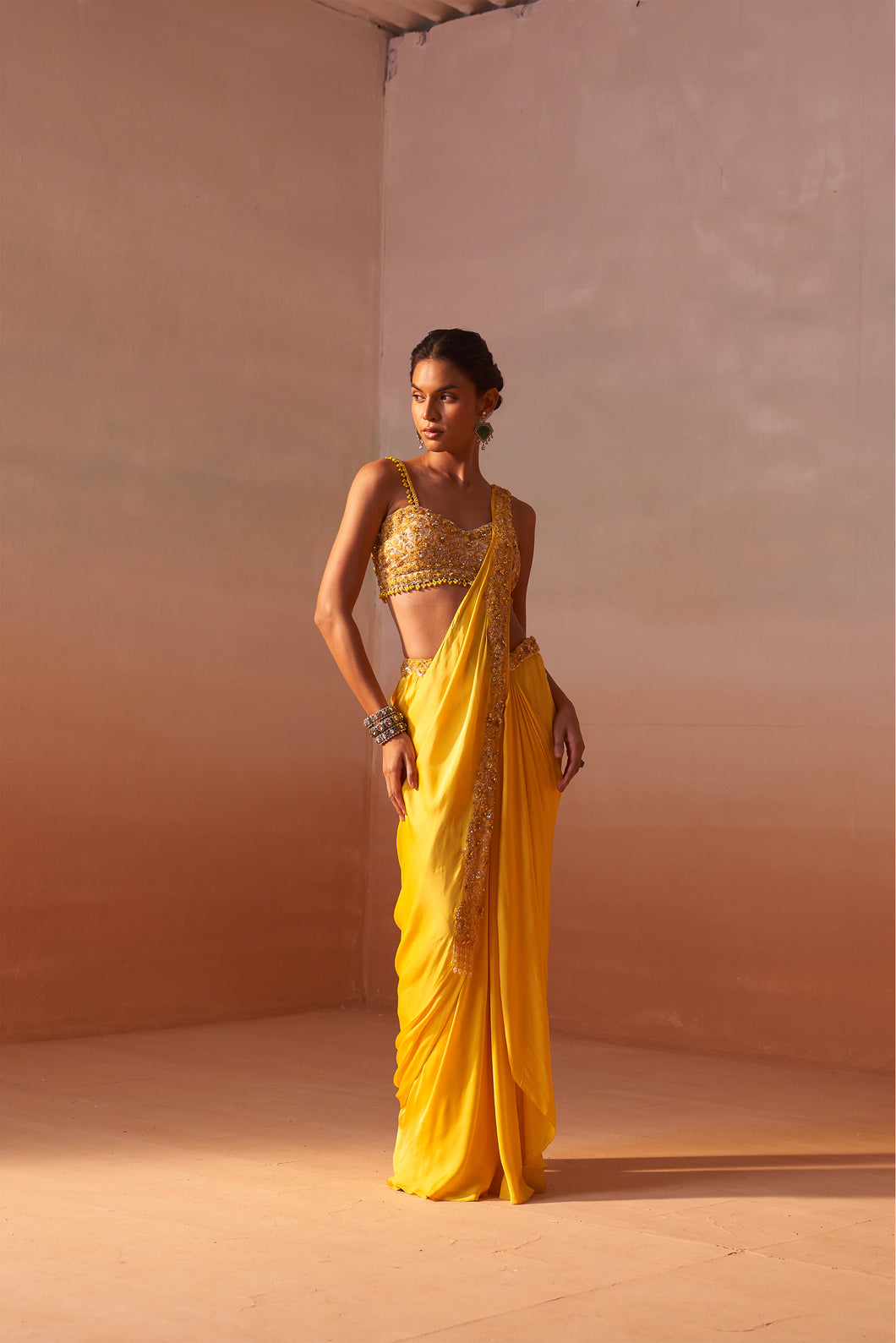 YELLOW DRAPED SAREE WITH NUDE CHOLI