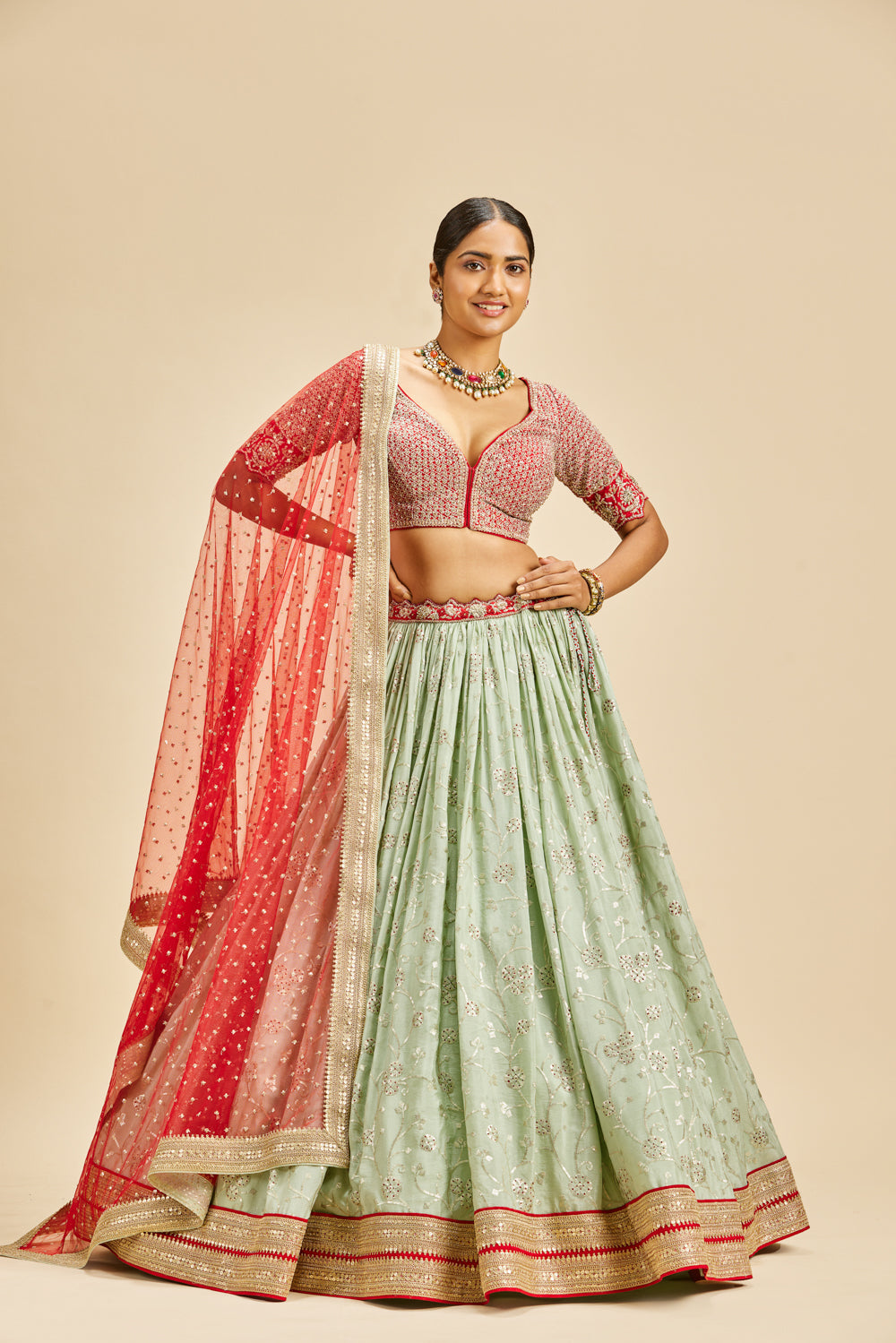 PISTA GREEN LEHENGA  WITH RED CHOLI AND DUPATTA