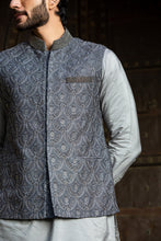 Load image into Gallery viewer, STEEL GREY KURTA AND PANT WITH ALL OVER EMBROIDERED RAW SILK NEHRU JACKET
