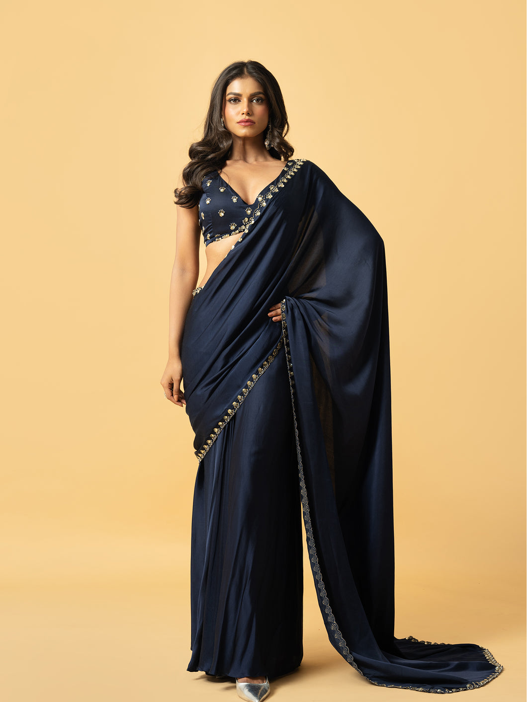 Blue modal satin saree with hand embroidered sleeveless blouse